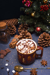 Obraz na płótnie Canvas hot chocolate with marshmallow slices in a brown ceramic mug