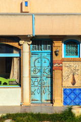 Fototapeta na wymiar Traditional blue door in El Jem.