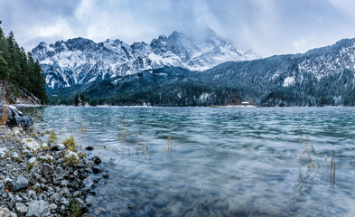 View of the famous Eibsee with alpine mountains in the background