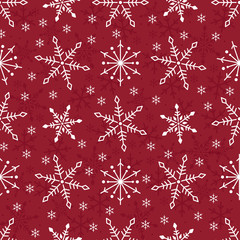 Simple seamless pattern with snowflakes.