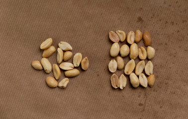Roasted, salted peanuts on brown paper