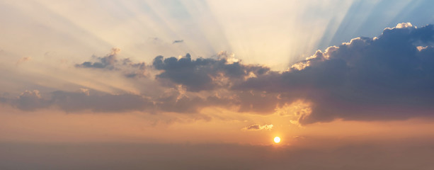 Beautiful sunset sky with rays of light