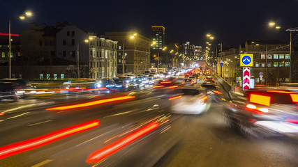 Fototapeta na wymiar night traffic on the urban thoroughfare and road junction