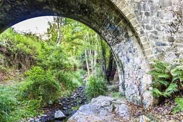 Arch of ancient stone bridge