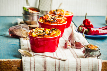 Portioned casserole.from corn grits, eggplant and tomato sauce. Vegetarian gluten free dinner.