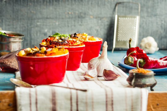 Portioned casserole.from corn grits, eggplant and tomato sauce. Vegetarian gluten free dinner.