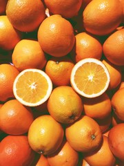 many fresh orange and cut half