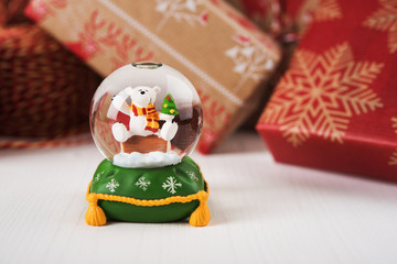 a little bear in a glass ball