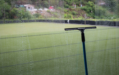 Cleaning windows with a squeegee