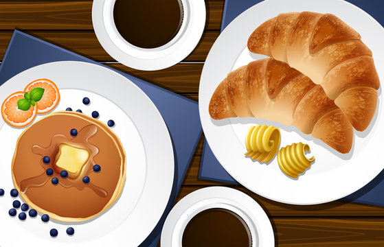 Croissants and pancakes on the table