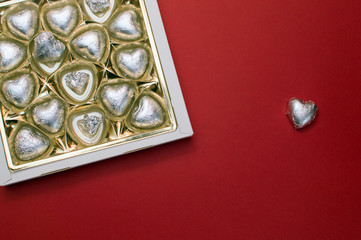 Beautiful mockup for Valentines day. Opened sweet box with chocolate heart shaped sweets inside.