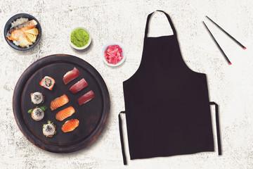 Blank black apron in a sushi restaurant