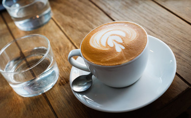 Beautiful coffee with leaf creme