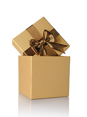 Golden classic shiny gift box with brown satin bow