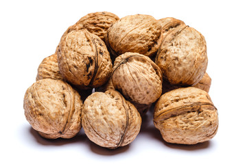 pile of walnuts isolated on white background