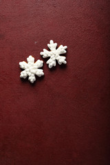 Red holiday christmas background with white snowflakes