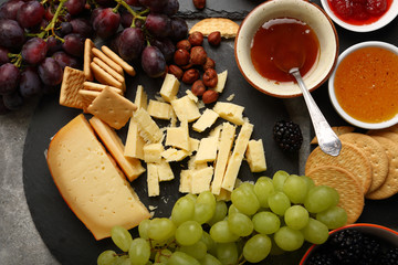 Fruits and cheese on slate