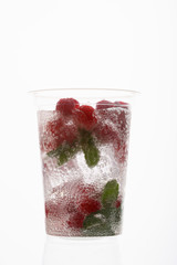 Water with ice and berry