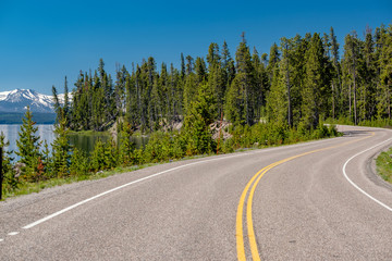 Fototapeta na wymiar Highway by the lake in Yellowstone