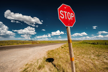 Stop sign on empty highway in Wyoming