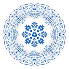 Decorative porcelain plate ornate with blue floral ornament pattern in traditional Russian style Gzhel