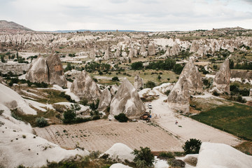 Beautiful view of the hills of Cappadocia in Turkey against the backdrop of a dramatic evening sky. They are one of the main natural attractions of these places.