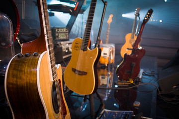 guitars stage composition in a vintage concert hall on light background