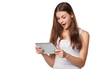 Happy girl using tablet. Excited woman with tablet pc, isolated on white background