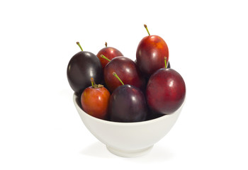 Fresh blue plum on a white background