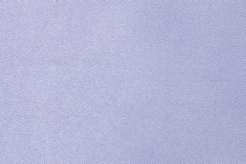 Fragment of blue fabric. Blue textile close-up.