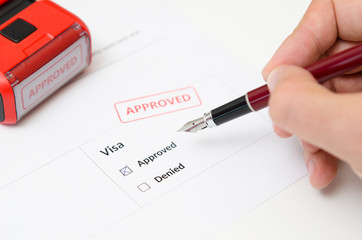 Visa and approved stamp on a document form