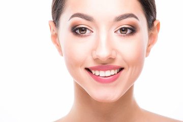 Obraz premium Beautiful Face of Young Woman with Clean Fresh Skin close up isolated on white. Beautiful Spa Woman Smiling. Perfect Fresh Skin. Pure Beauty Model. Youth and Skin Care Concept