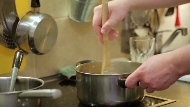 Stirring food in pan during cooking