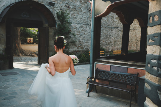 Bride Walking Away On Street