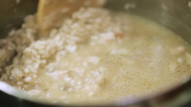 Stirring risotto in pan during cooking