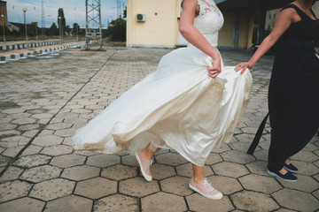 Fototapeta na wymiar Bride walking with a girl