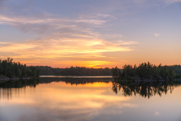 Naklejka na ściany i meble sunset over a forest lake