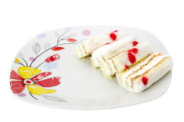 Cakes on a plate with pattern isolated on white