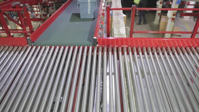 Packages at Conveyor Belt in Distribution Warehouse