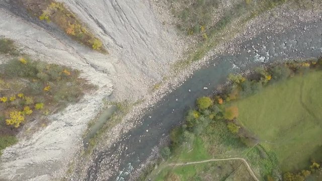 Top down aerial view of moving river Prut in Carpathian Mountains near by Yaremche, ukraine