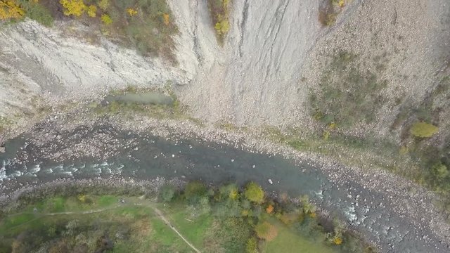 Top down aerial view of moving river Prut in Carpathian Mountains near by Yaremche, ukraine