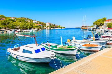 Fototapeta na wymiar Fishing boats anchoring in small port of Razanj, Dalmatia, Croatia