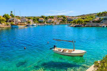 Fototapeta na wymiar Fishing boat anchoring in beautiful bay with turquoise sea water in Razanj port, Dalmatia, Croatia
