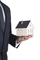 Hand of the businessman with the house