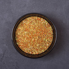 Spice mix - dill, parsley, basil, marjoram, oregano, savory, tomato, paprika, coriander, garlic, chili in a bowl