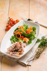 stuffed rolled up swordfish with mixed salad