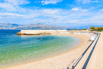 View of beach with turquoise sea water in Postira village, Brac island, Croatia