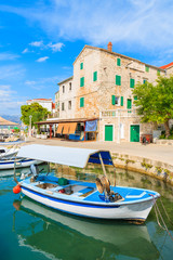 Naklejka premium Fishing boat in Postira village with beautiful port, Brac island, Croatia