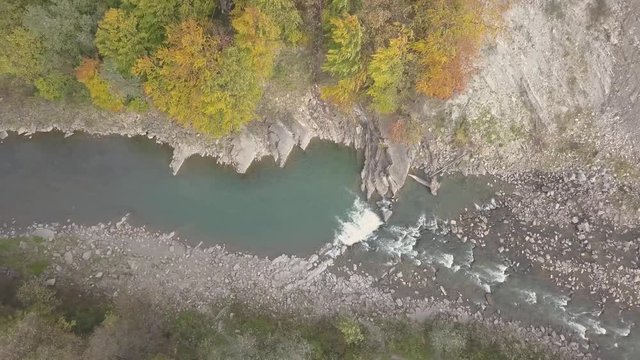 Top down aerial view of moving river Prut in Carpathian Mountains near by Yaremche, ukraine