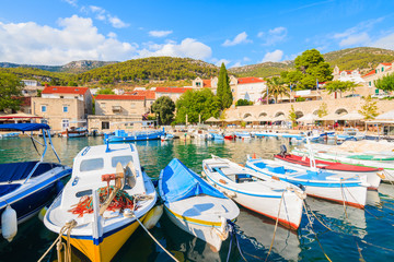 Fototapeta na wymiar Typical colorful fishing boats in Bol port on Brac island, Dalmatia, Croatia